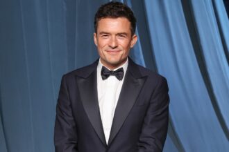 Orlando Bloom Shows Off Abs During Family Getaway With His Kids